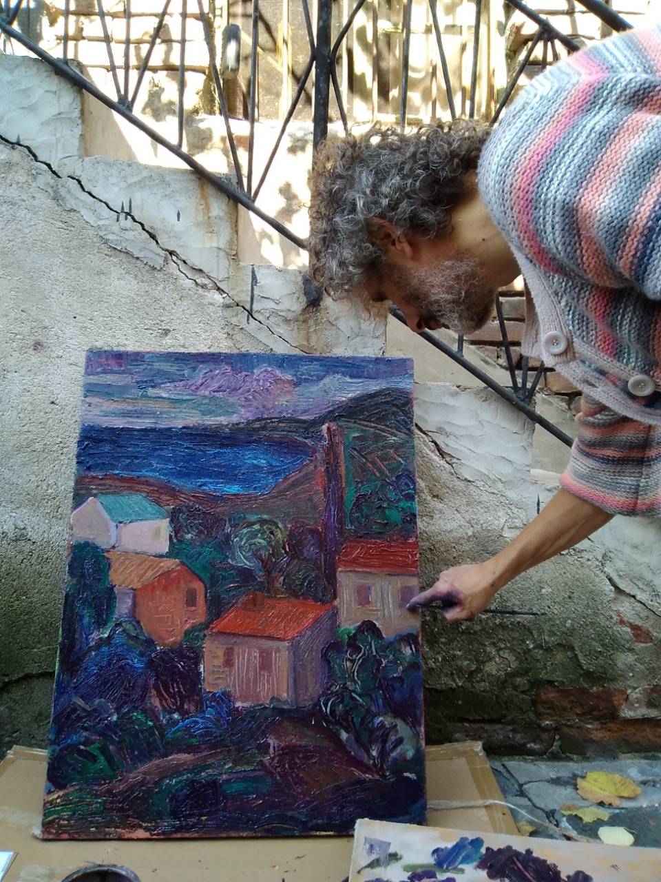 Valeri while painting with oil